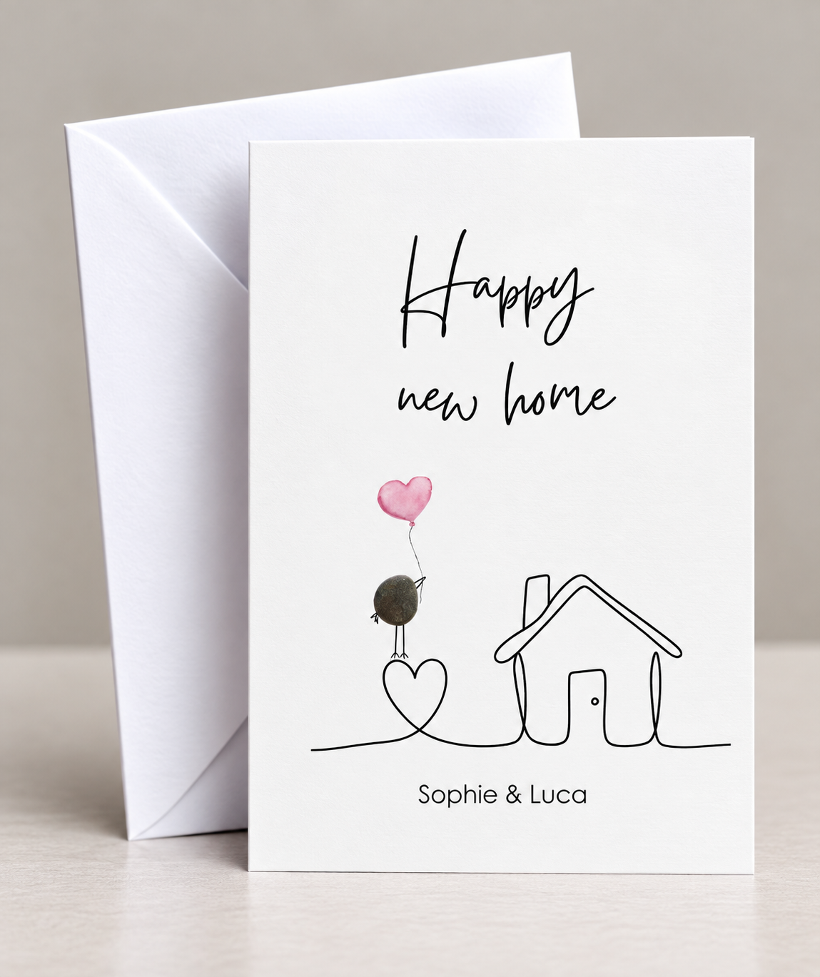 Handgemachte weiße Klappkarte mit Kieselstein, mit Spruch „Happy new home"