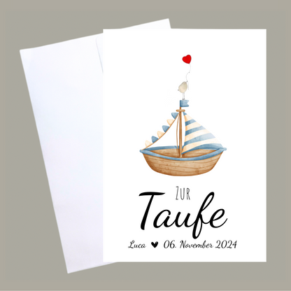 Handgemachte weiße Klappkarte mit Kieselstein, mit Spruch „Zur Taufe" und Boot blau mit Vogel