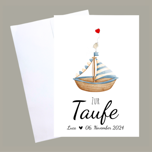 Handgemachte weiße Klappkarte mit Kieselstein, mit Spruch „Zur Taufe" und Boot blau mit Vogel