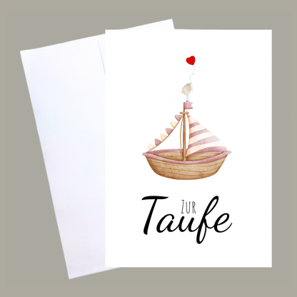 Handgemachte weiße Klappkarte mit Kieselstein, mit Spruch „Zur Taufe" und Boot rosa mit Vogel