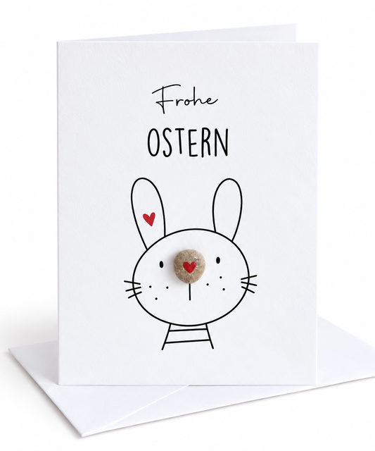 Handgemachte weiße Klappkarte mit Kieselstein-Nase und Osterhase, Spruch „Frohe Ostern“ – Osterkarte, Grußkarte mit Umschlag